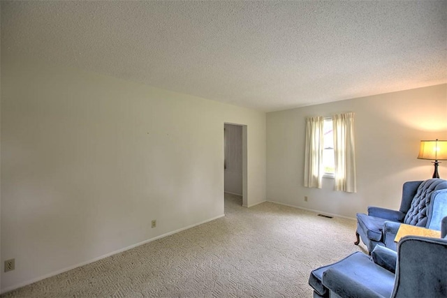 4324 Cleveland Ave, Decatur, IL 62521 - living area featuring light colored carpet and a textured ceiling