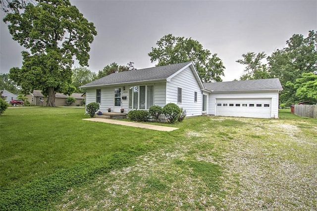 4324 Cleveland Ave, Decatur, IL 62521 - ranch-style house with a garage, driveway, and a front yard