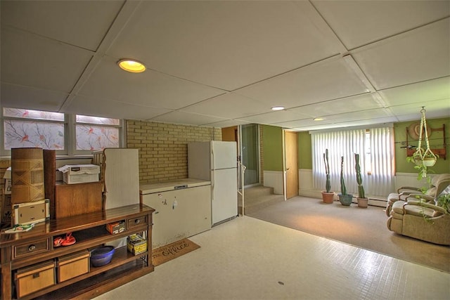 427 S Madison St, Cerro Gordo, IL 61818 - basement with freestanding refrigerator, recessed lighting, wainscoting, and a drop ceiling