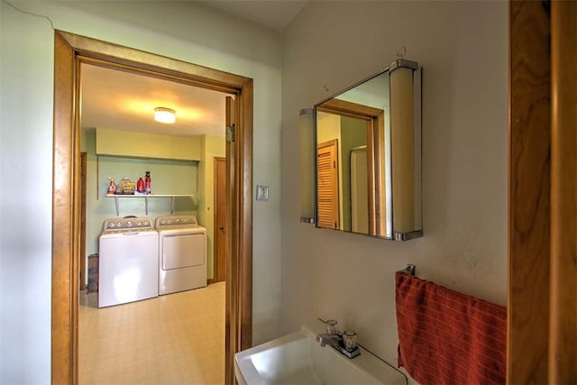 427 S Madison St, Cerro Gordo, IL 61818 - bathroom featuring washer and clothes dryer and a sink