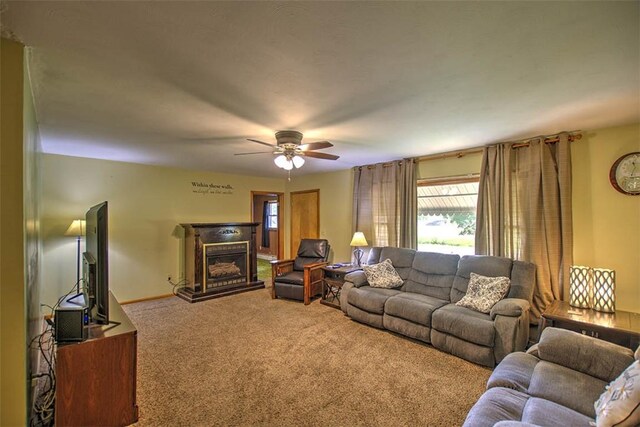 427 S Madison St, Cerro Gordo, IL 61818 - carpeted living room with a ceiling fan and a glass covered fireplace