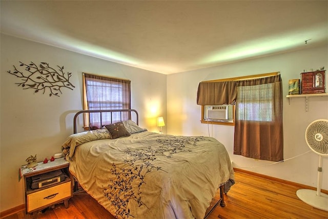 427 S Madison St, Cerro Gordo, IL 61818 - bedroom featuring cooling unit, wood finished floors, and baseboards