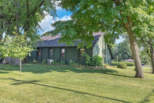 4170 N Taylor Ave, Decatur, IL 62526 - view of front of home with a front lawn and a shingled roof