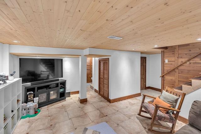 4170 N Taylor Ave, Decatur, IL 62526 - living room featuring wooden ceiling, stairs, and recessed lighting
