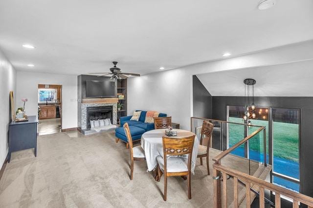 4170 N Taylor Ave, Decatur, IL 62526 - living area with a ceiling fan, a stone fireplace, carpet floors, and recessed lighting