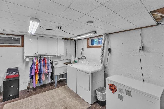 4170 N Taylor Ave, Decatur, IL 62526 - washroom with washing machine and dryer and cabinet space