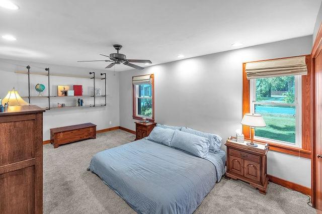 4170 N Taylor Ave, Decatur, IL 62526 - bedroom with light colored carpet, multiple windows, recessed lighting, and ceiling fan