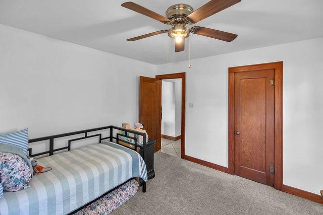 4170 N Taylor Ave, Decatur, IL 62526 - bedroom featuring light colored carpet and a ceiling fan