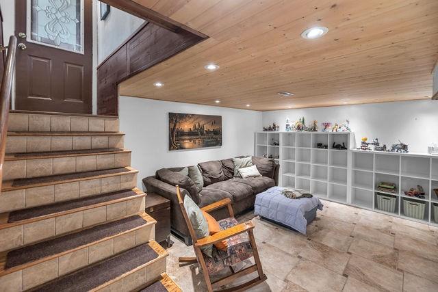 4170 N Taylor Ave, Decatur, IL 62526 - living room featuring wooden ceiling, stairway, and recessed lighting