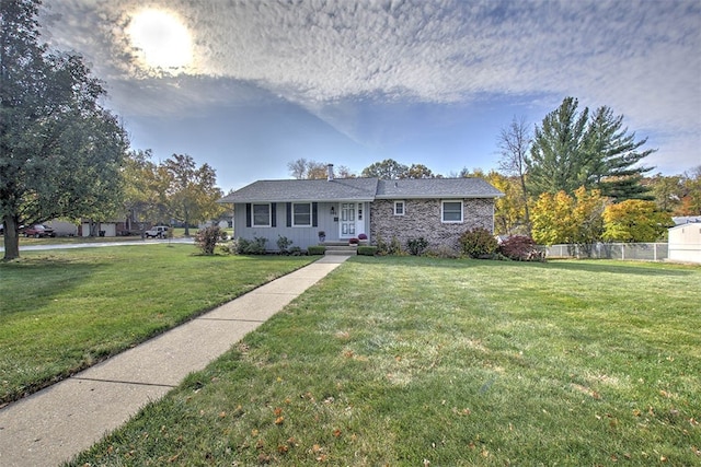 ranch-style home featuring a front yard