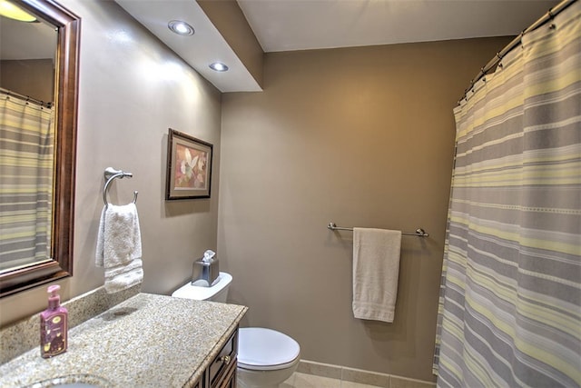 bathroom with tile patterned floors, vanity, and toilet