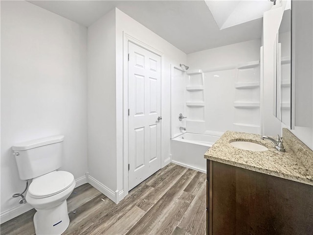 full bathroom featuring vanity, toilet, wood finished floors, and baseboards