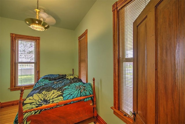 9010 School Rd, Argenta, IL 62501 - bedroom with baseboards and wood finished floors