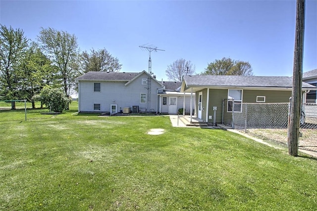 back of house with a lawn, fence, and a patio area