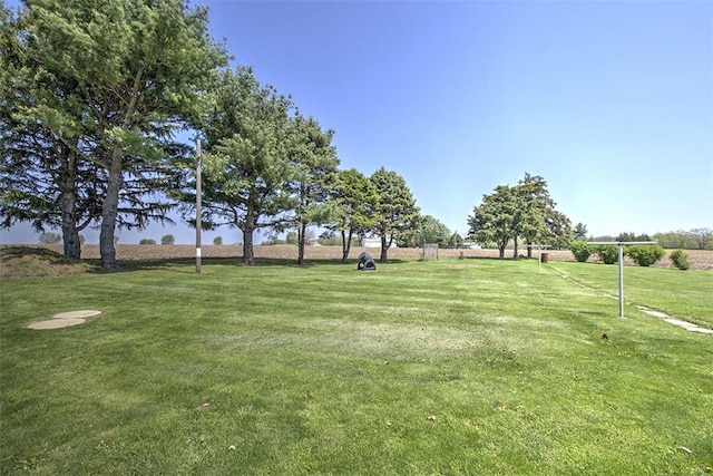 surrounding community with a yard