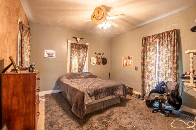 101 W N Water St, Bethany, IL 61914 - carpeted bedroom featuring baseboards and a ceiling fan