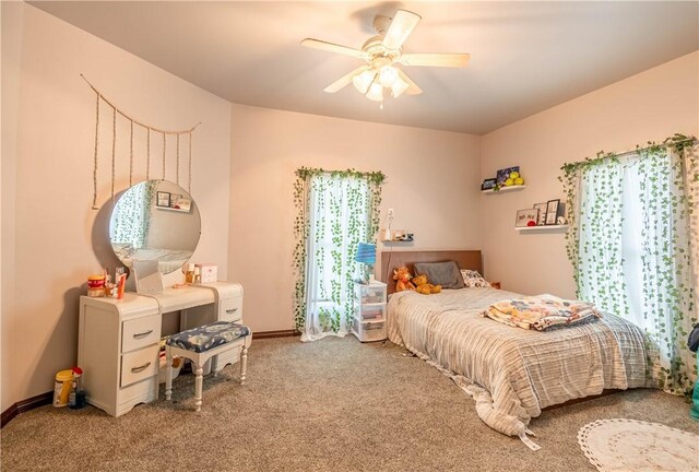 101 W N Water St, Bethany, IL 61914 - carpeted bedroom with a ceiling fan and baseboards