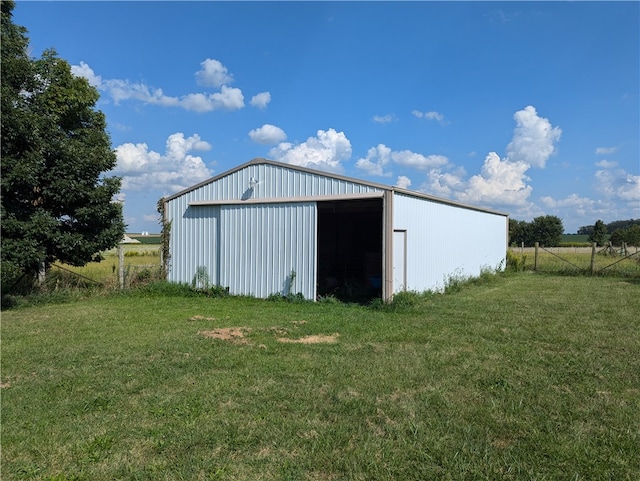 view of outbuilding featuring a lawn