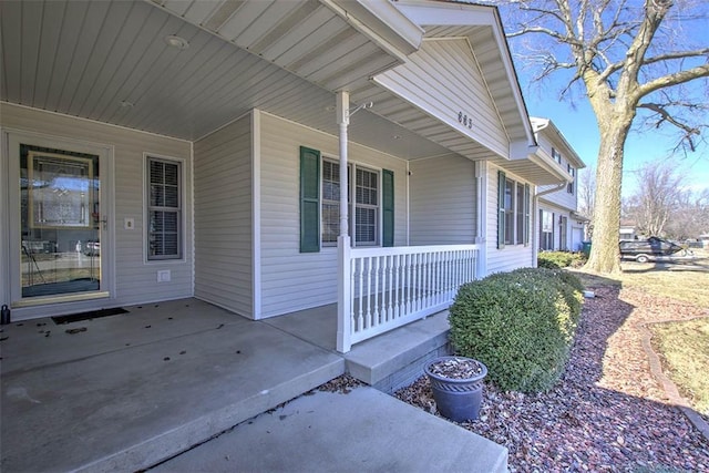 doorway to property featuring covered porch