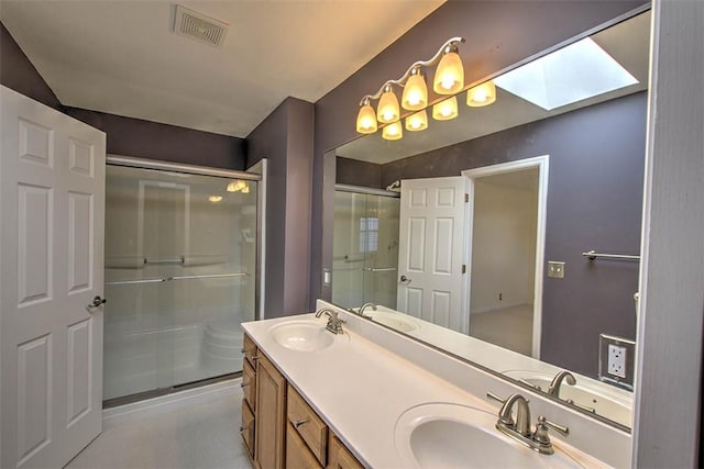 bathroom featuring a sink, visible vents, and a shower stall