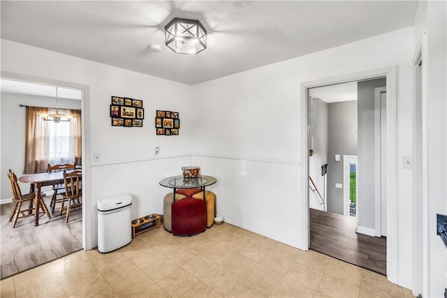 1450 W Westside Dr, Mt Zion, IL 62549 - dining space with a chandelier, wainscoting, and wood finished floors