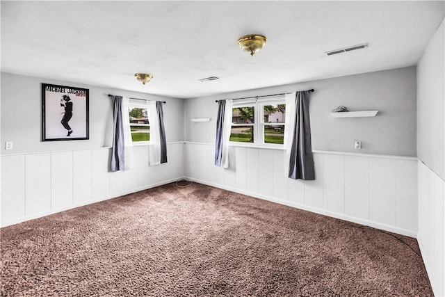1450 W Westside Dr, Mt Zion, IL 62549 - carpeted spare room featuring a wainscoted wall