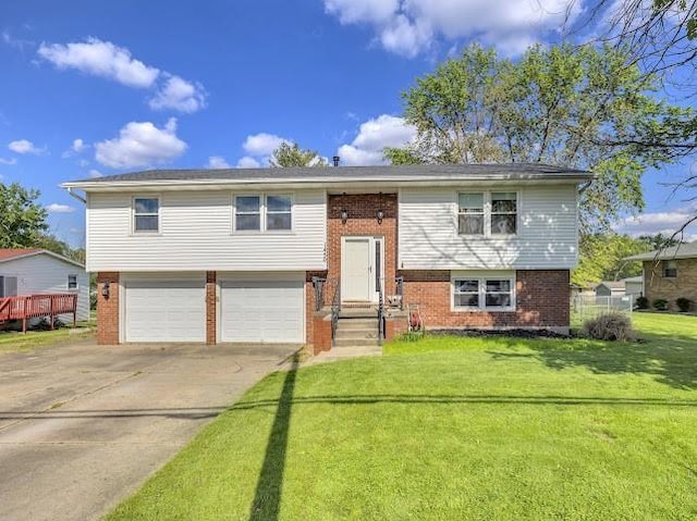 1450 W Westside Dr, Mt Zion, IL 62549 - raised ranch with brick siding, an attached garage, driveway, a front yard, and entry steps