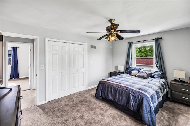 1450 W Westside Dr, Mt Zion, IL 62549 - carpeted bedroom with a closet, baseboards, and a ceiling fan