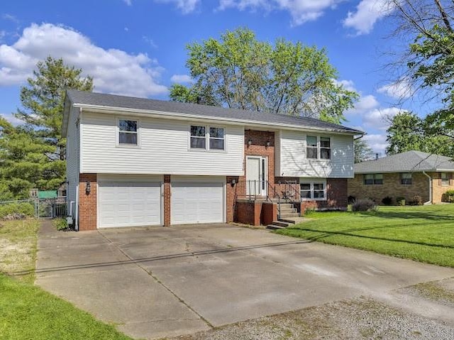 1450 W Westside Dr, Mt Zion, IL 62549 - split foyer home featuring driveway, brick siding, and an attached garage