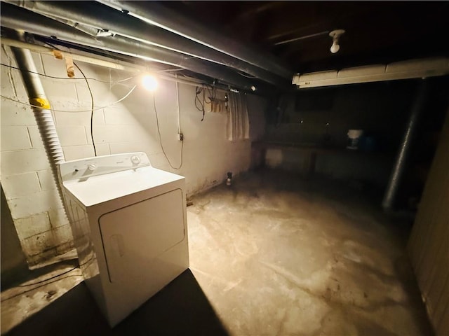 unfinished basement featuring washer / dryer