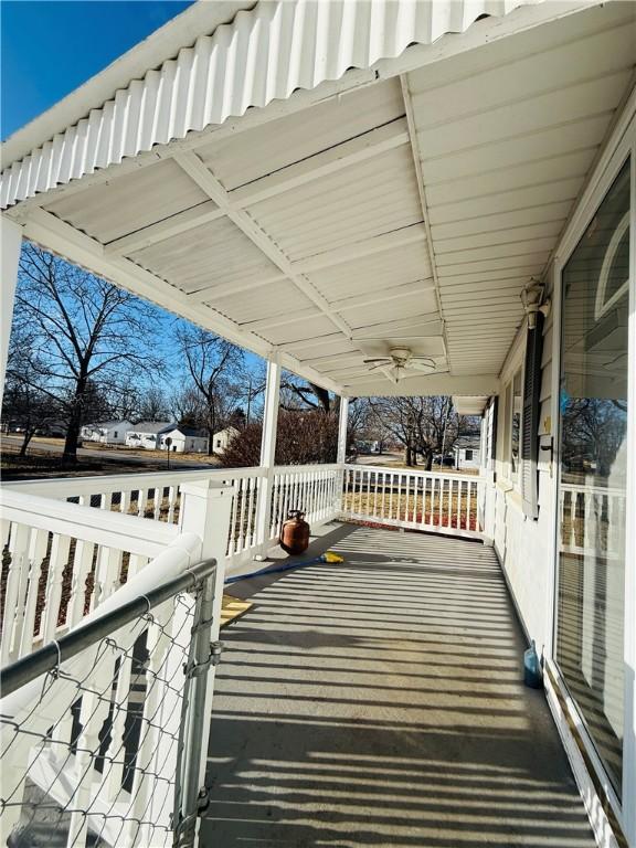 wooden terrace with a porch