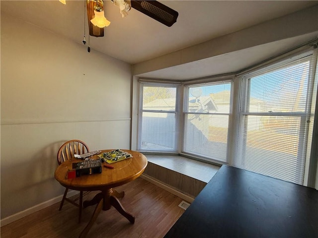 unfurnished sunroom with ceiling fan and visible vents