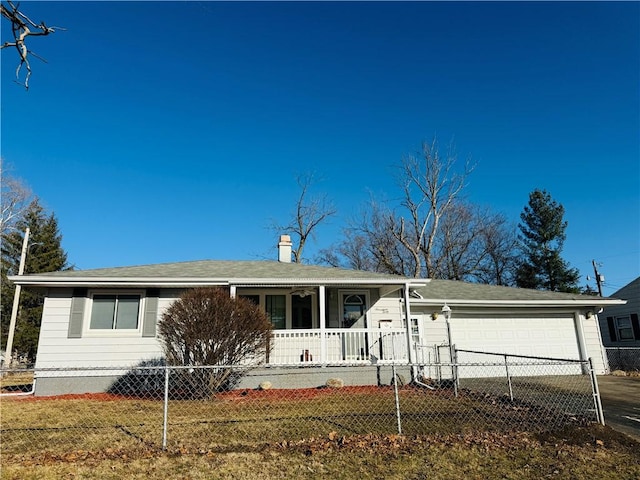 view of front of house featuring a fenced front yard, concrete driveway, a porch, and an attached garage