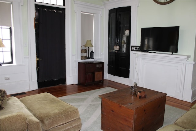 living room with light hardwood / wood-style flooring