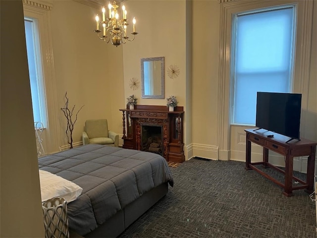 carpeted bedroom with a notable chandelier