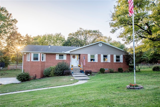 ranch-style house with a front lawn