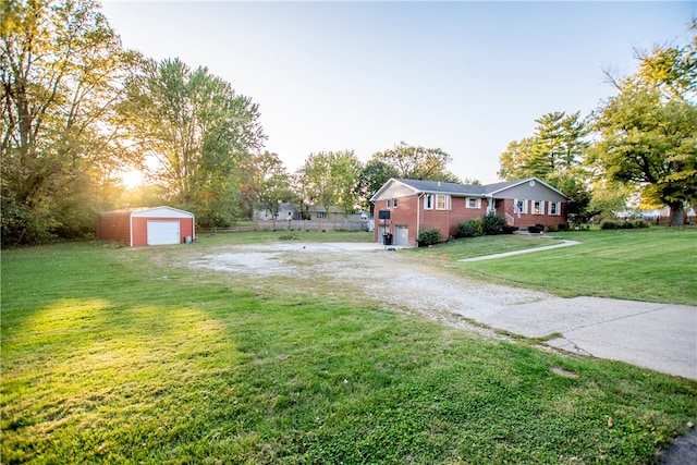 view of yard featuring an outbuilding and a garage