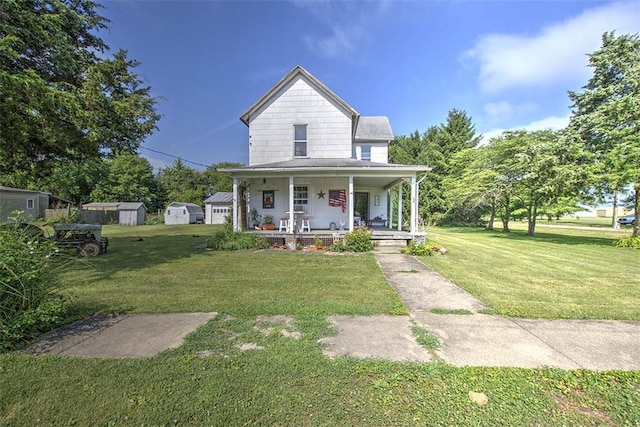 59 Lynn St, Weldon, IL 61882 - farmhouse featuring covered porch, a front yard, and a storage unit