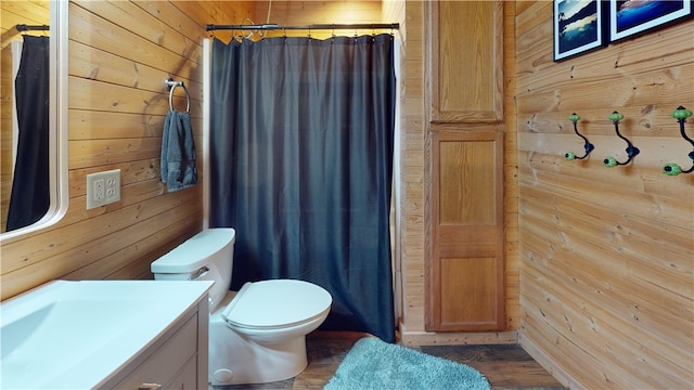202 Eagle Blf, Oakwood, IL 61858 - full bathroom with wood walls, vanity, toilet, a shower with shower curtain, and wood finished floors