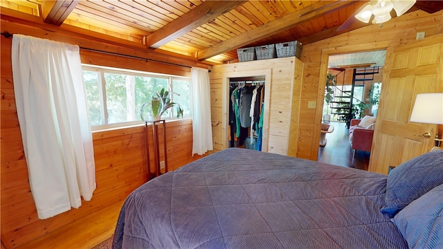 202 Eagle Blf, Oakwood, IL 61858 - bedroom featuring wood walls, beamed ceiling, wood finished floors, and wooden ceiling
