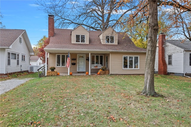 cape cod house with a front lawn and a porch