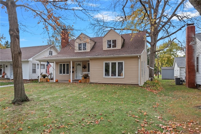 cape cod house with central AC and a front lawn