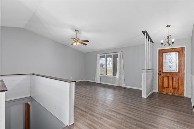 entryway with baseboards, wood finished floors, ceiling fan with notable chandelier, and lofted ceiling