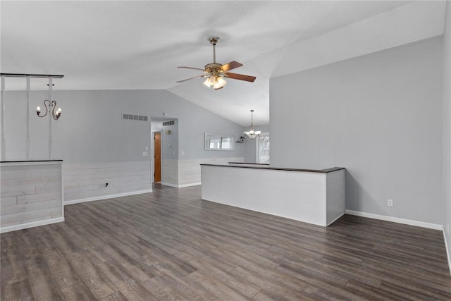 unfurnished living room with visible vents, wood finished floors, lofted ceiling, and ceiling fan with notable chandelier