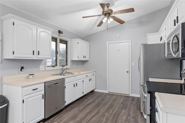 kitchen with a sink, dark wood-type flooring, a ceiling fan, white cabinetry, and appliances with stainless steel finishes