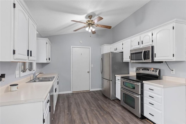 kitchen with ceiling fan, stainless steel appliances, white cabinetry, and a sink