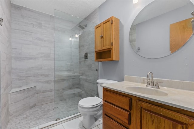 full bath with toilet, tile patterned floors, tiled shower, and vanity