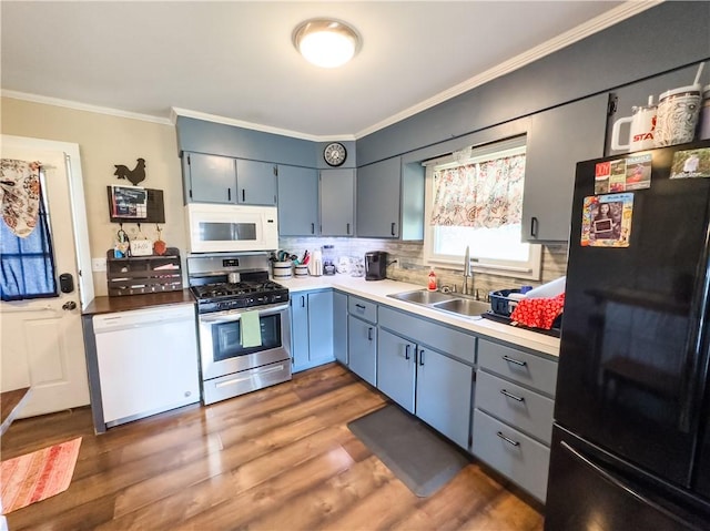 421 S 8th St, Marshall, IL 62441 - kitchen with white appliances, ornamental molding, decorative backsplash, wood finished floors, and blue cabinetry