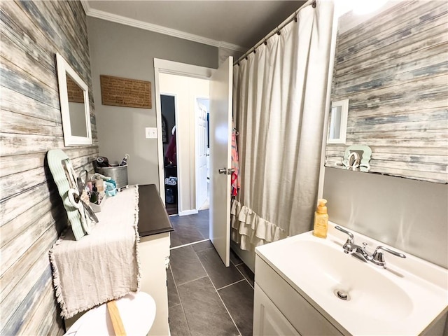 421 S 8th St, Marshall, IL 62441 - full bath featuring wooden walls, an accent wall, vanity, ornamental molding, and tile patterned floors