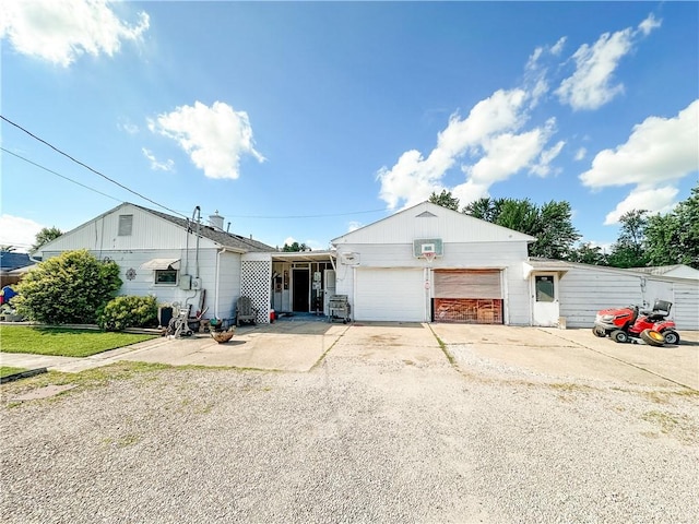 421 S 8th St, Marshall, IL 62441 - view of front of property with a garage and gravel driveway